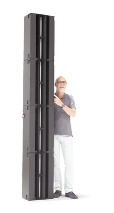 Alcons Audio Introduces The CRMSQ Modular Line-Source Column Array. Man stands next to The CRMSQ Modular Line-Source Column Array.