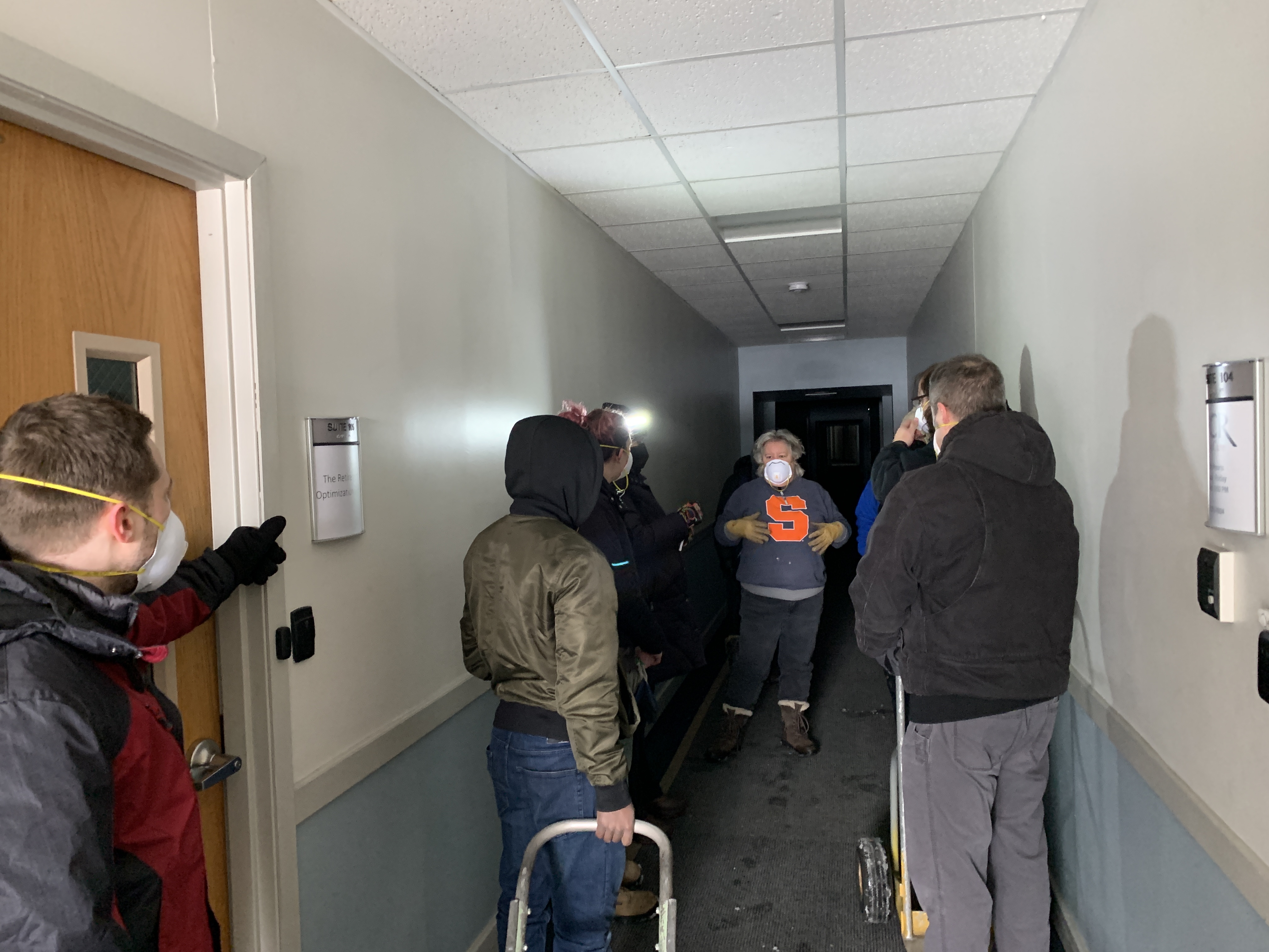 Director of Education & Training Christine Troscher gives instructions to USITT staff and volunteers from Syracuse Scenery and Stage Lighting before entering the USITT offices to load out for USITT25 on Thursday, Feb. 20.