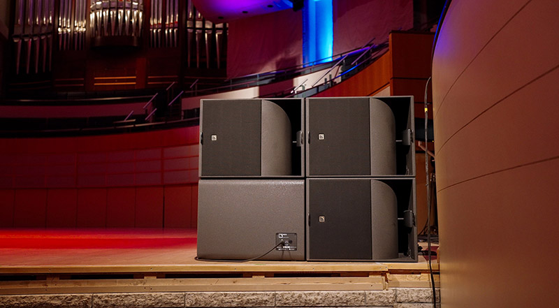 Four KS21 subs, in a cardioid configuration, sit on each side of the stage below the main arrays